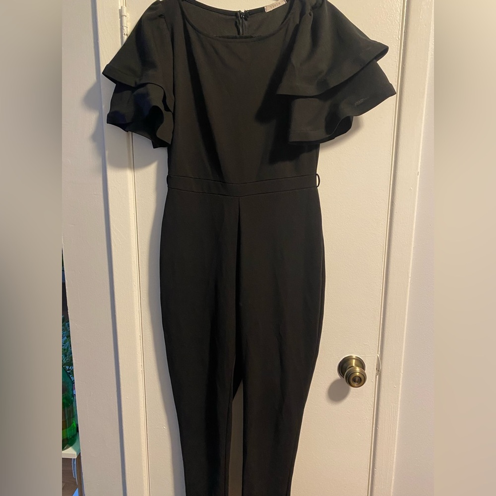 Stretchy black jumpsuit with double layered bell sleeves. Flattering fit!
